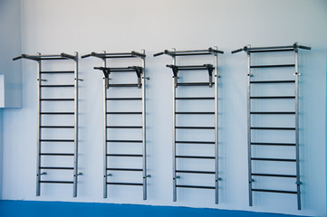 Wall bars in the gym. Wall bars in the school gymnastic hall