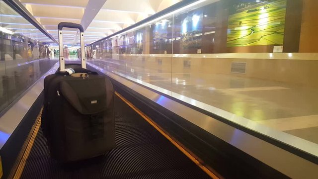 A lonely handluggage suitcase on the treadmill of an airport in Taiwan