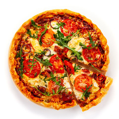 Pizza with ham, rucola, and vegetables on white background