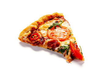 Slice of pizza with ham, rucola, and vegetables on white background