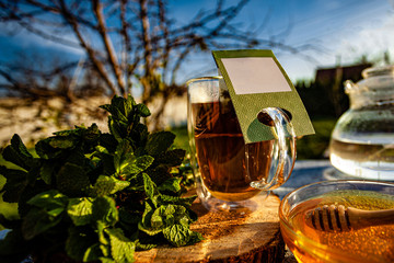 hot tea and honey in teacup outdoor