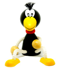 Toy, wooden crow on a white background.