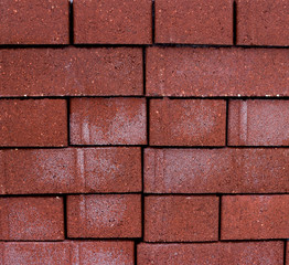 Stack of red bricks on the street.