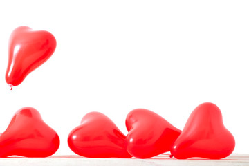 heart shaped red balloons isolated on white background