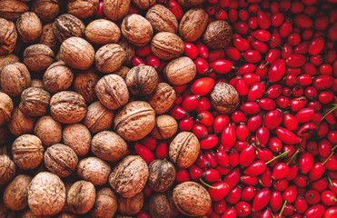 Autumn harvest composition with walnuts and rose hip