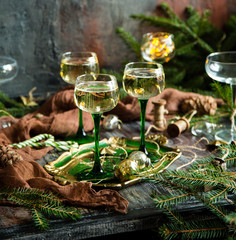 vintage wine glasses with champagne on old wooden green tray