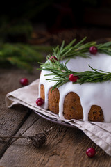 Fototapeta na wymiar Closeup of the traditional homemade Christmas fruit cake on the wooden background