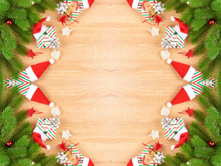 Christmas background with fir branches, various Christmas decorations, colored garlands and beads, on a light wood background. Christmas decorations. Christmas background. Space for text.