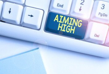 Handwriting text Aiming High. Conceptual photo a result that your plans or actions are intended to achieve White pc keyboard with empty note paper above white background key copy space