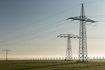 electricity pylons at sunset