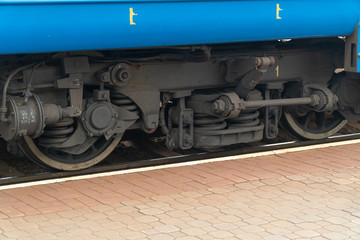 Fototapeta na wymiar railway engine and wheelset of passenger locomotive on the railway