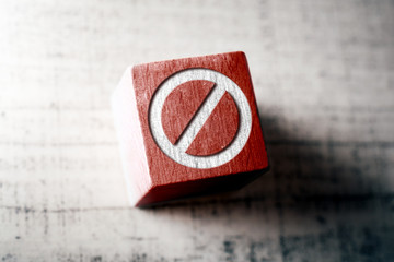 Prohibition Sign On A Red Wooden Block On A Table