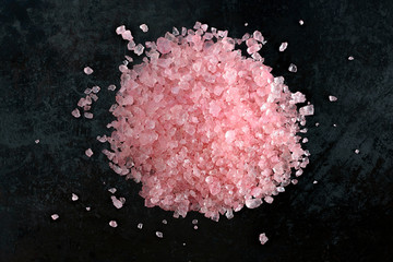 Pink himalayan salt on black background, macro