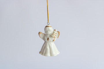 Christmas Angel -  Christmas decorations on a white background with copy space.  Winter holidays greetings. Merry Christmas minimal background concept.