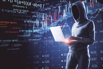 hacker using laptop with stock data