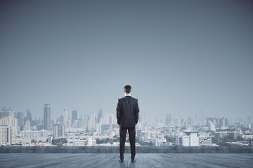 Attractive businessman on rooftop