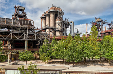 Fototapeta premium Industrial factory in Duisburg, Germany. Public park Landschaftspark, landmark and tourist attraction.