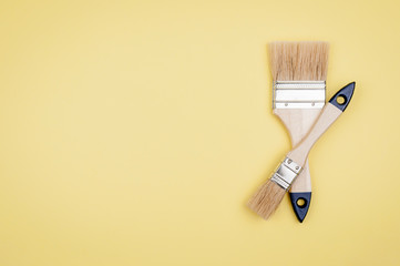 House painter tool on a yellow background.