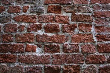 Closeup of a very old crumbling brick wall