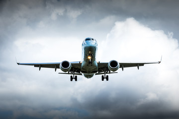 Jet airplane flying in the cloudy skies