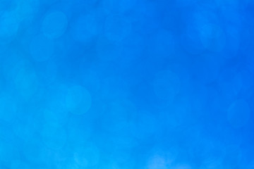 Abstract defocused blue gradient bokeh background pattern