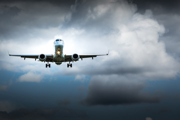 Jet airplane flying in the cloudy skies
