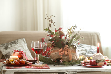 Beautifully decorated Christmas table in the living room.