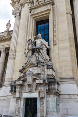 Fototapeta na wymiar The Artistic Revelation sculpture group by Paul Gasq at the facade of Grand Palais, Paris