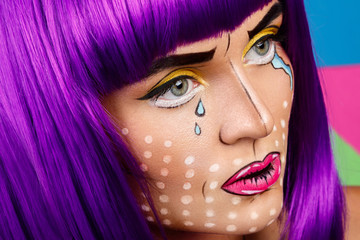 Model in creative image with pop art makeup