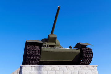 Legendary Soviet tank T-34 at war in the second world war on a blue sky background.