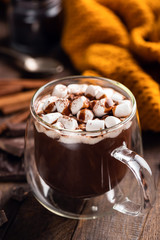 Glass Mug Of Hot Chocolate With Marshmallows On Wooden Table