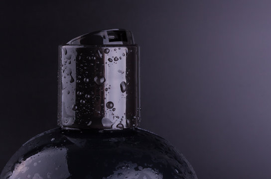 Black Shampoo Bottle On Black Background