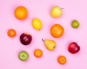 Fruits flat lay on pink background