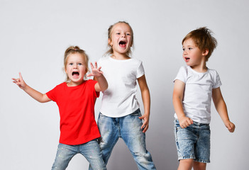 Active kids girls and little boy friends pickles screaming loud making noise having fun. Childhood,...