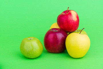 Apples on green background