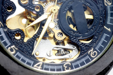 Mechanical skeleton watch on a white background