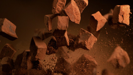 Flying pieces of crushed chocolate pieces