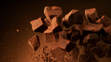 Flying pieces of crushed chocolate pieces