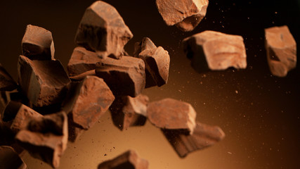 Flying pieces of crushed chocolate pieces