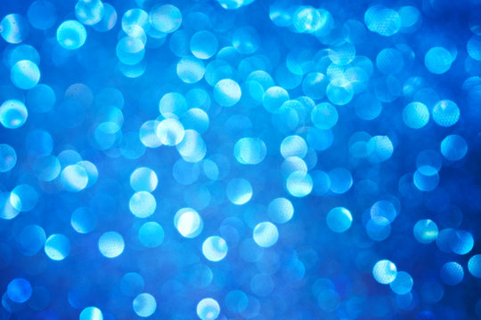 Defocus abstract show. Festive morning or evening blue lights. Bright background and backdrop.