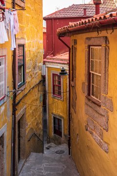 Colorful dwellings along the escadas do Barredo walkway in Porto, Portugal.