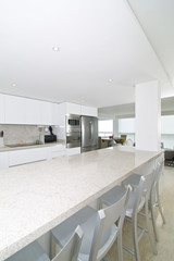 Interior of modern kitchen in beach apartment.