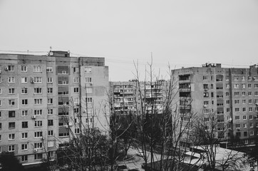 Multi-storey panel house, old. Houses of the USSR, roof, stairs, communications. Black and white...