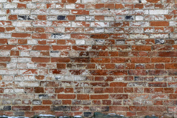 17th century brickwork texture. Weathered stained old brick wall background.