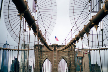 Flag above Brooklyn Bridge New York