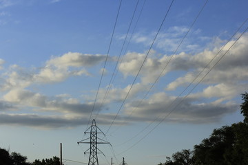 Electricity  Pylons with cables,wires, on a Tower with blue sky and white clouds in Hutchinson Kansas USA.