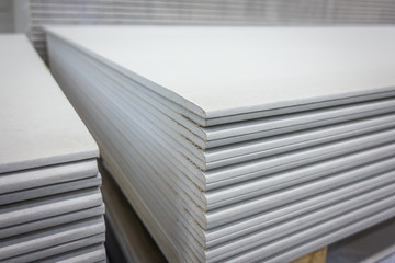 Stack of gypsum boards is being prepared for construction - obrazy, fototapety, plakaty