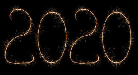 Happy New Year. 2020 written by bright sparkling sparklers. New year logo for design.