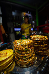 Close up of mont pyar tha lat at the night street market Yangon Myanmar