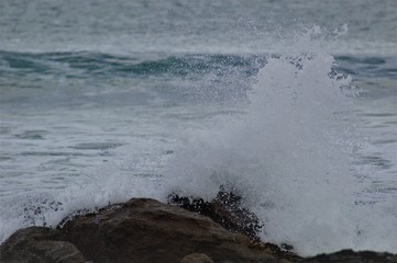 waves crashing on rocks